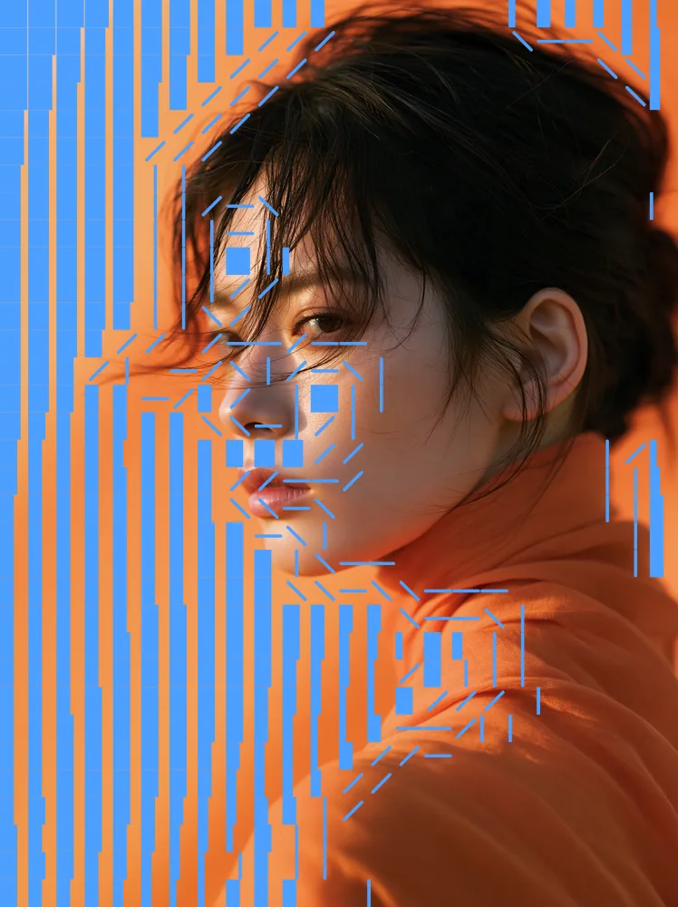 ASCII Art Effect on a photo of a woman in an orange turtleneck