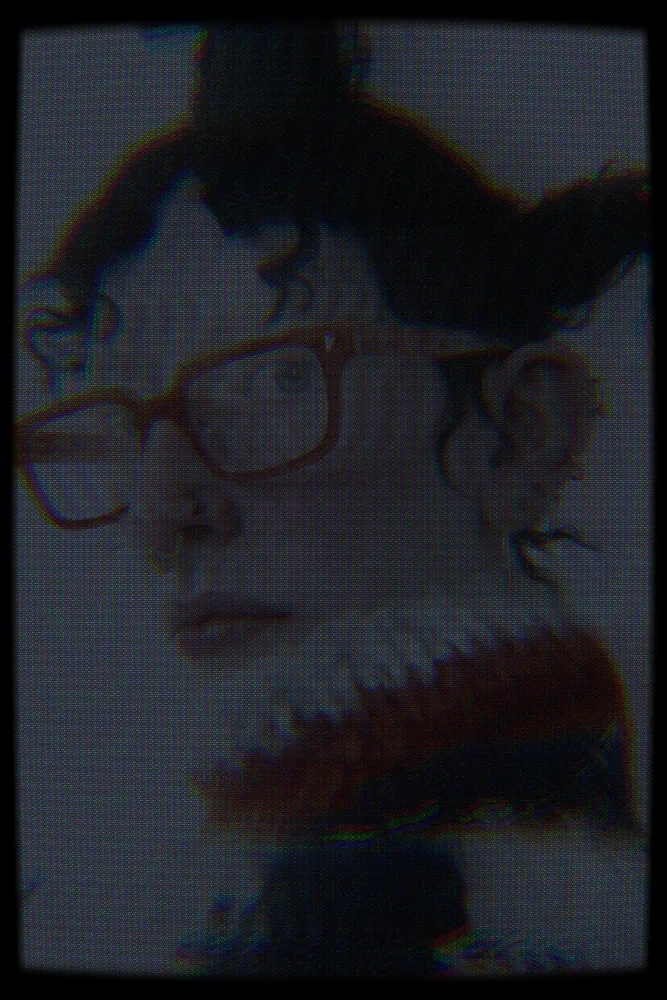 CCTV Effect on a photo of a woman in orange glasses and a knit collar