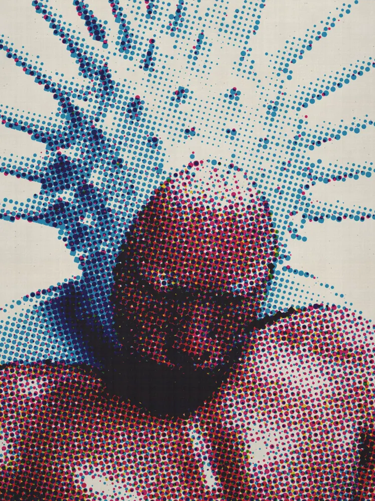 CMYK Effect on a photo of a man in a spiked blue hood