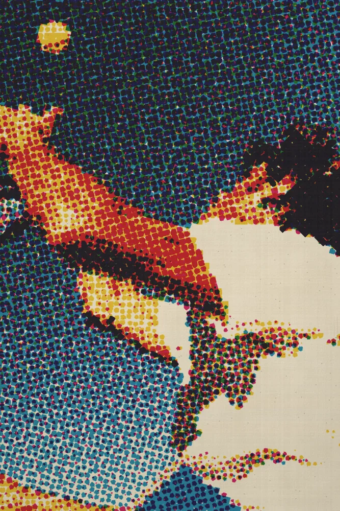CMYK Effect on a photo of a man reaching into a blue sky