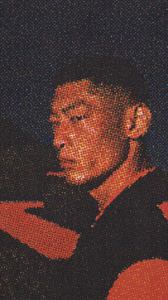 CMYK Effect on a photo of a man with a buzz cut against red and blue