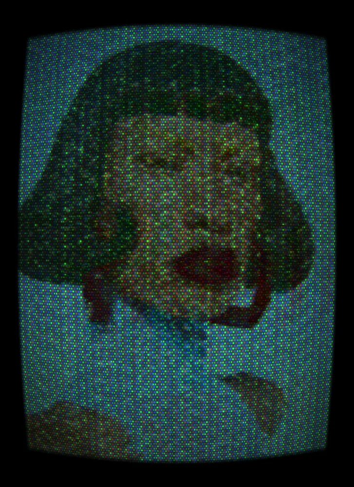 CRT Effect on a photo of a woman with a black bob and red earrings