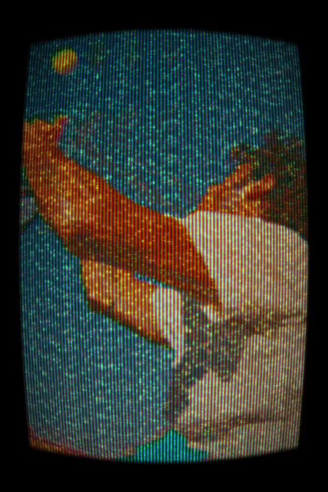 CRT Effect on a photo of a man reaching into a blue sky