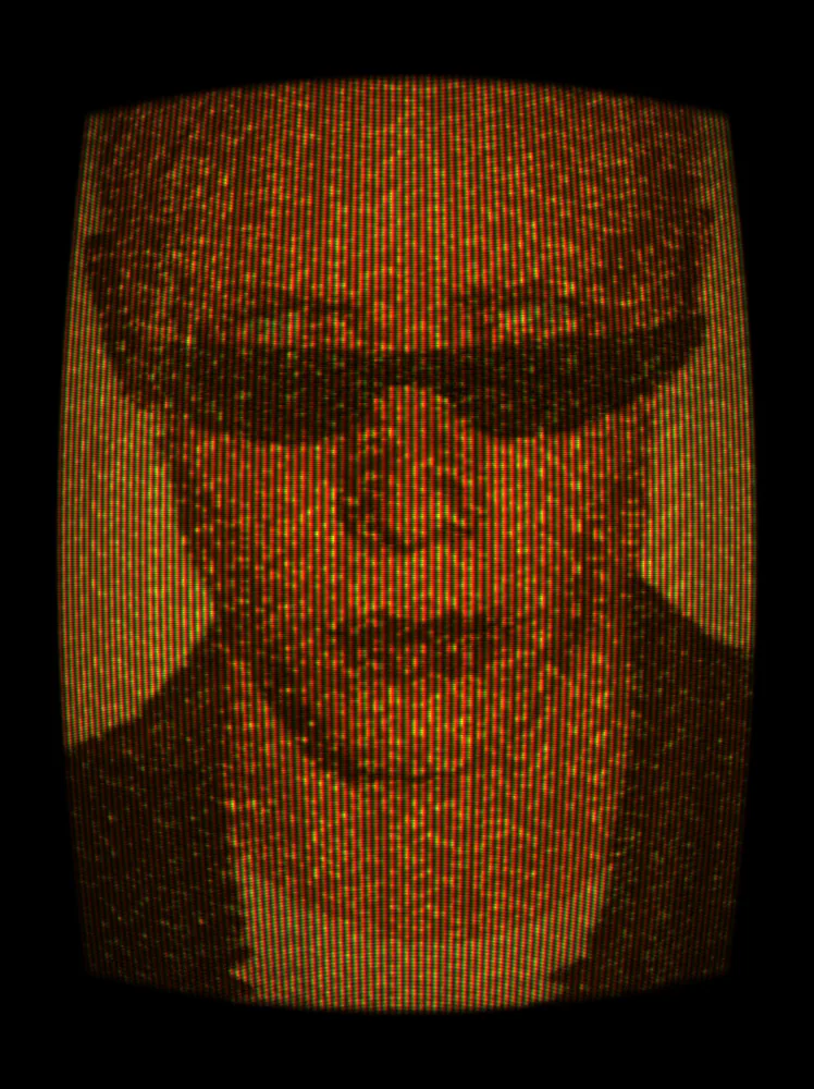CRT Effect on a photo of a man with pink hair and black sunglasses