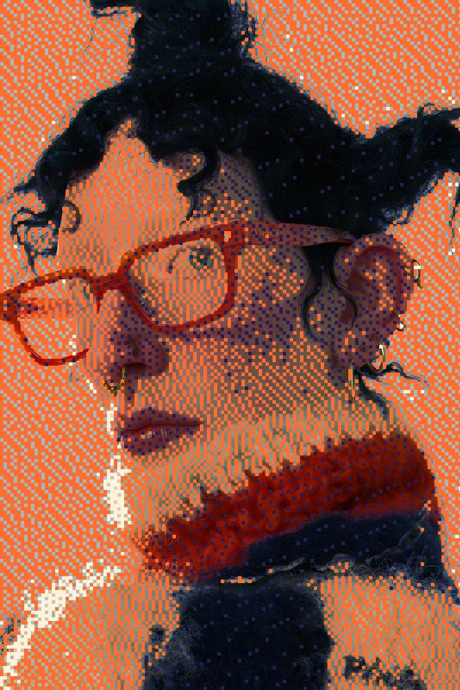 Dither Effect on a photo of a woman in orange glasses and a knit collar
