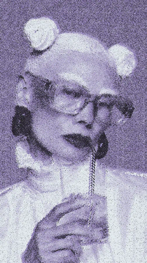 Halftone Effect on a photo of a woman in blue glasses