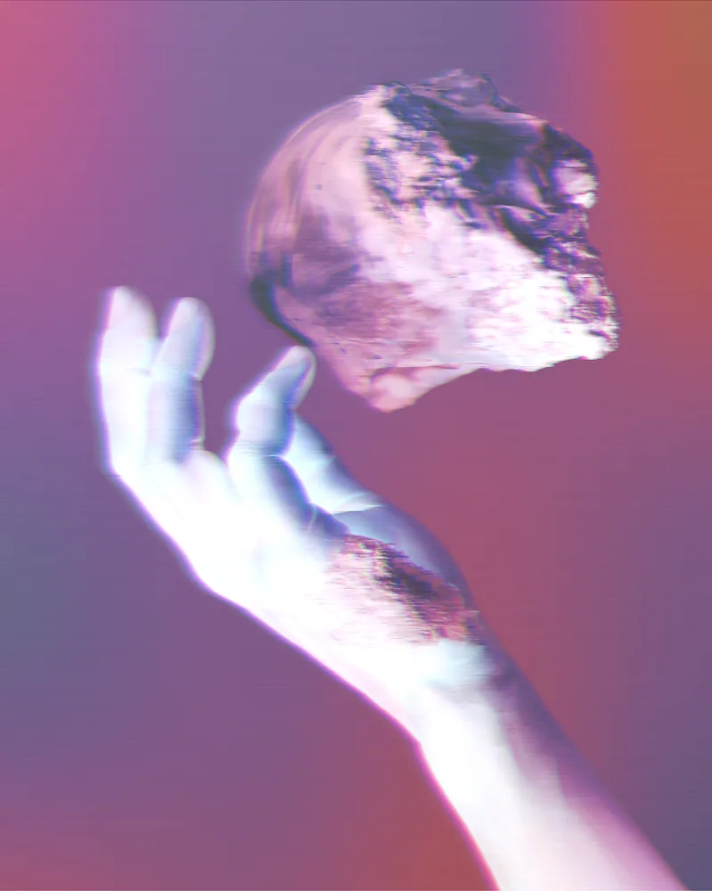 Holographic Effect on a photo of a hand holding a floating rock