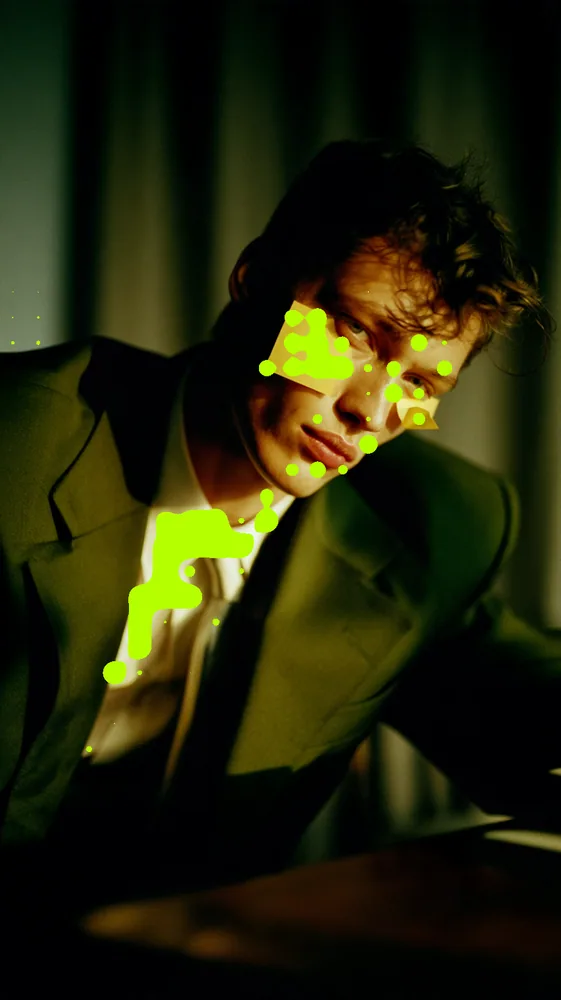 Metaball Effect on a photo of a man in a suit under yellow light