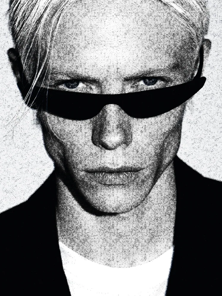 Newspaper Effect on a photo of a man with pink hair and black sunglasses