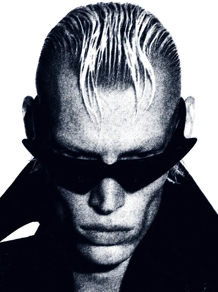 Newspaper Effect on a photo of a man with slicked blond hair and sunglasses