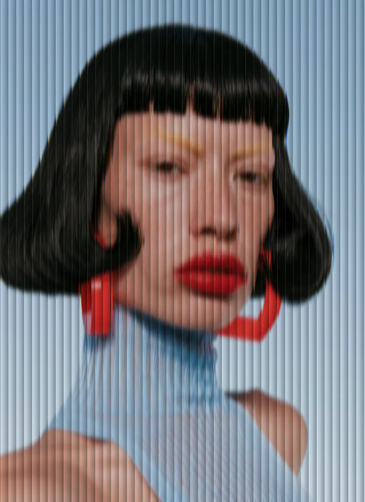 Reeded Glass Effect on a photo of a woman with a black bob and red earrings