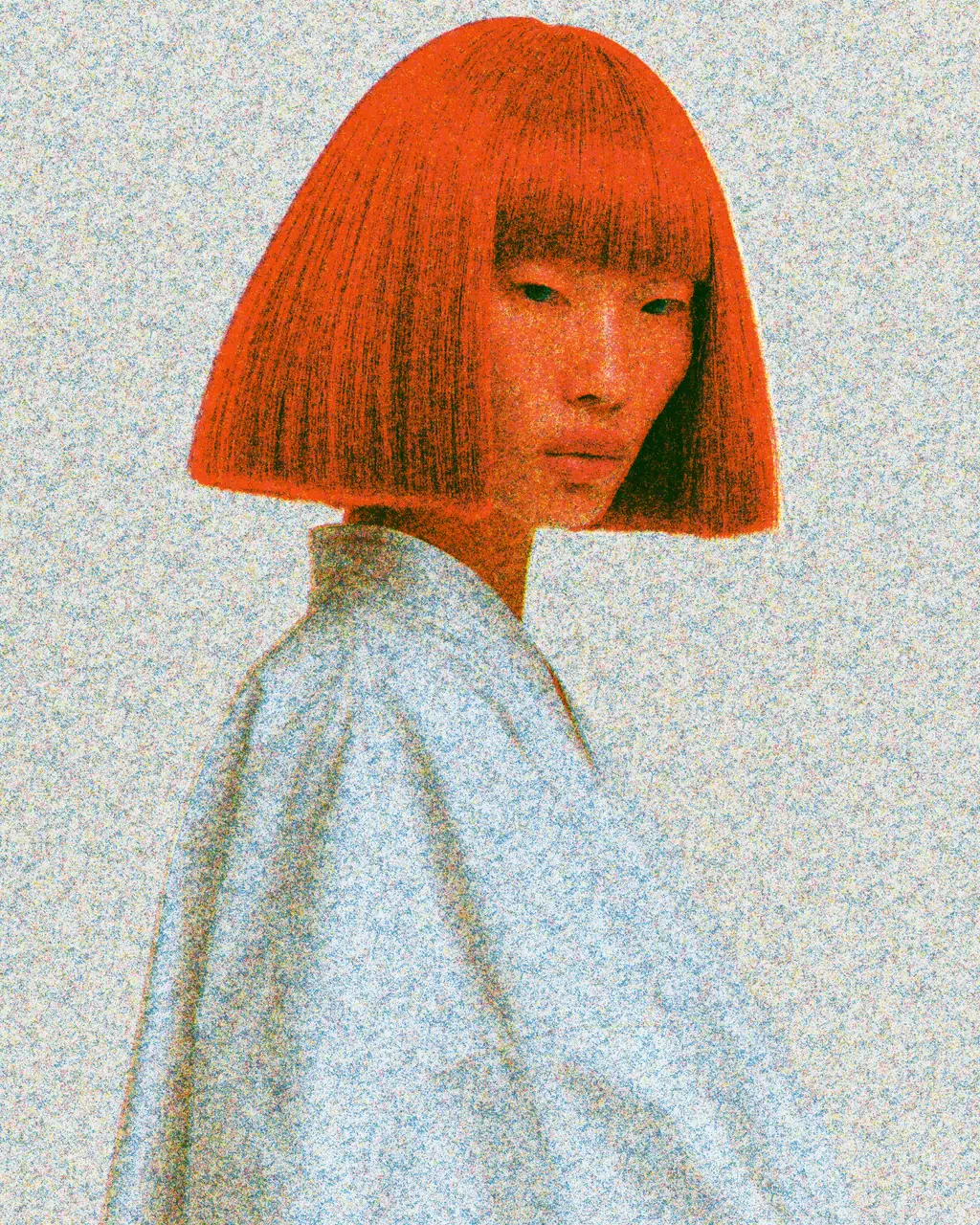 The same portrait as a grainy riso print: orange-red hair, a pale blue shirt and background covered in speckled blue and yellow ink grain.