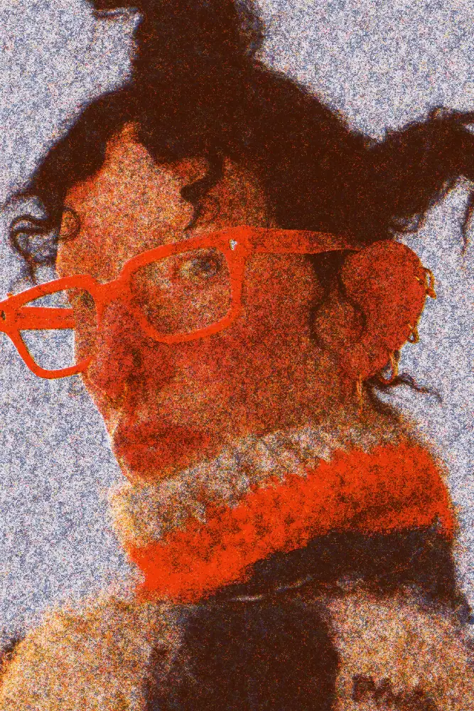 Risograph Effect on a photo of a woman in orange glasses and a knit collar
